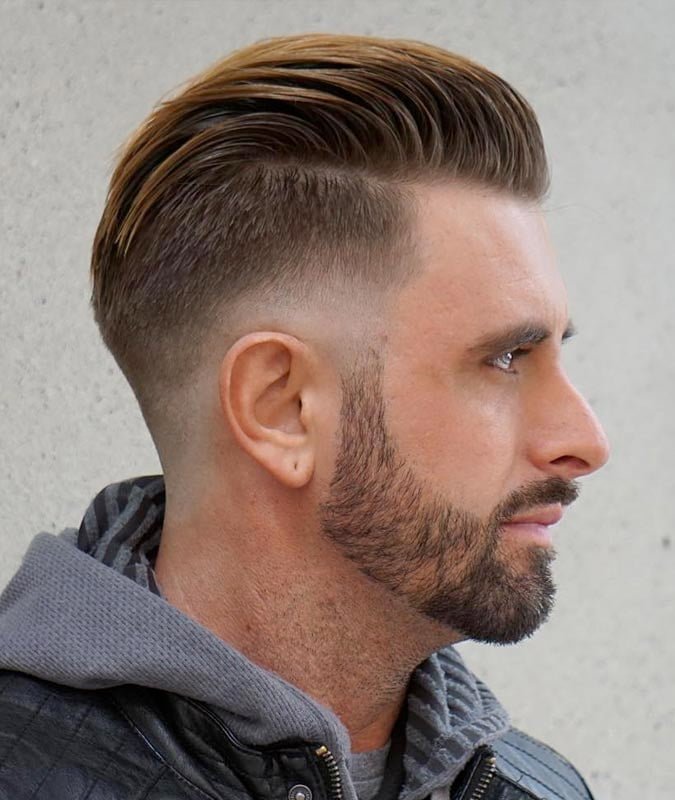 Textured Sweep Back + Mid Fade Haircut For Men 