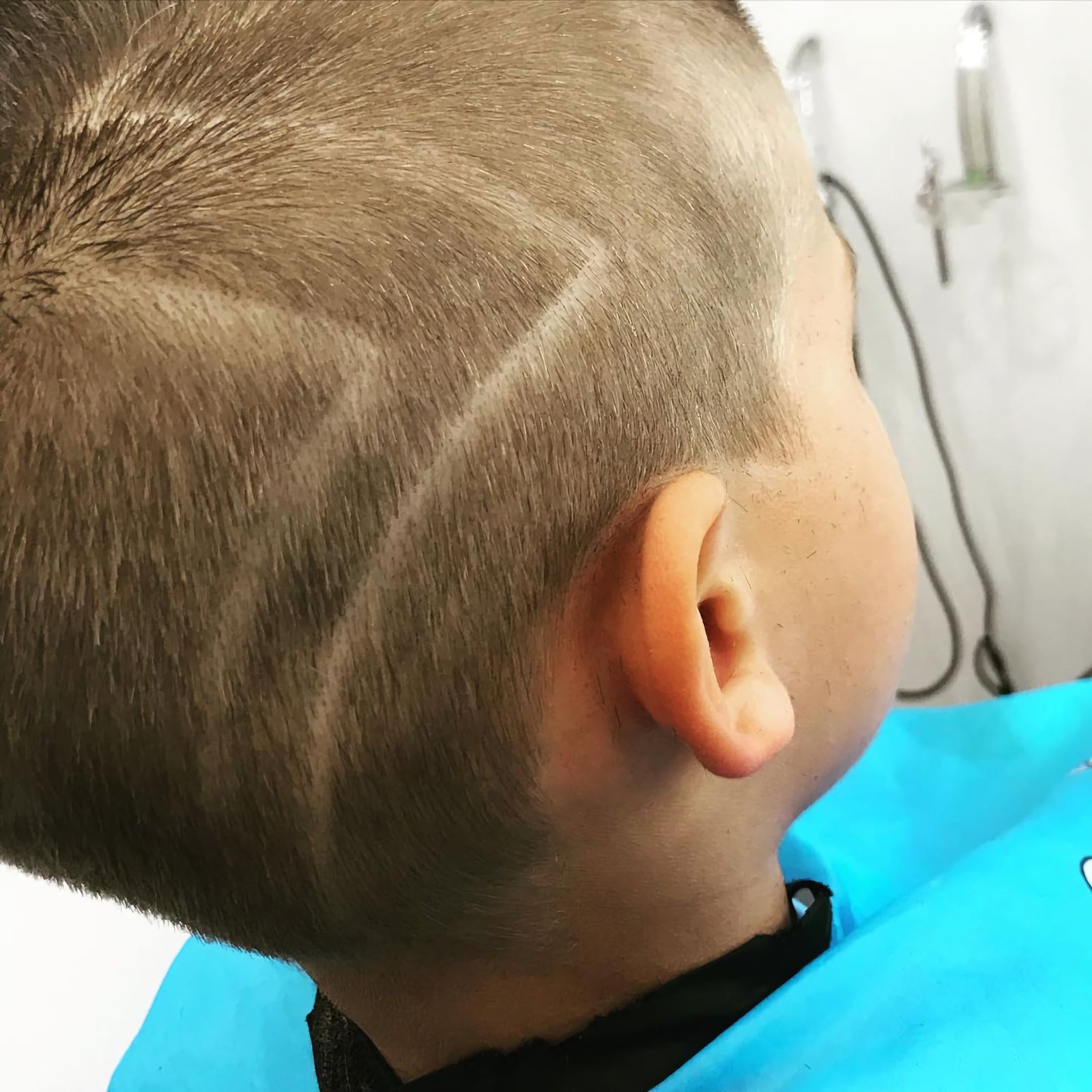 Short children's haircut with shaved waves