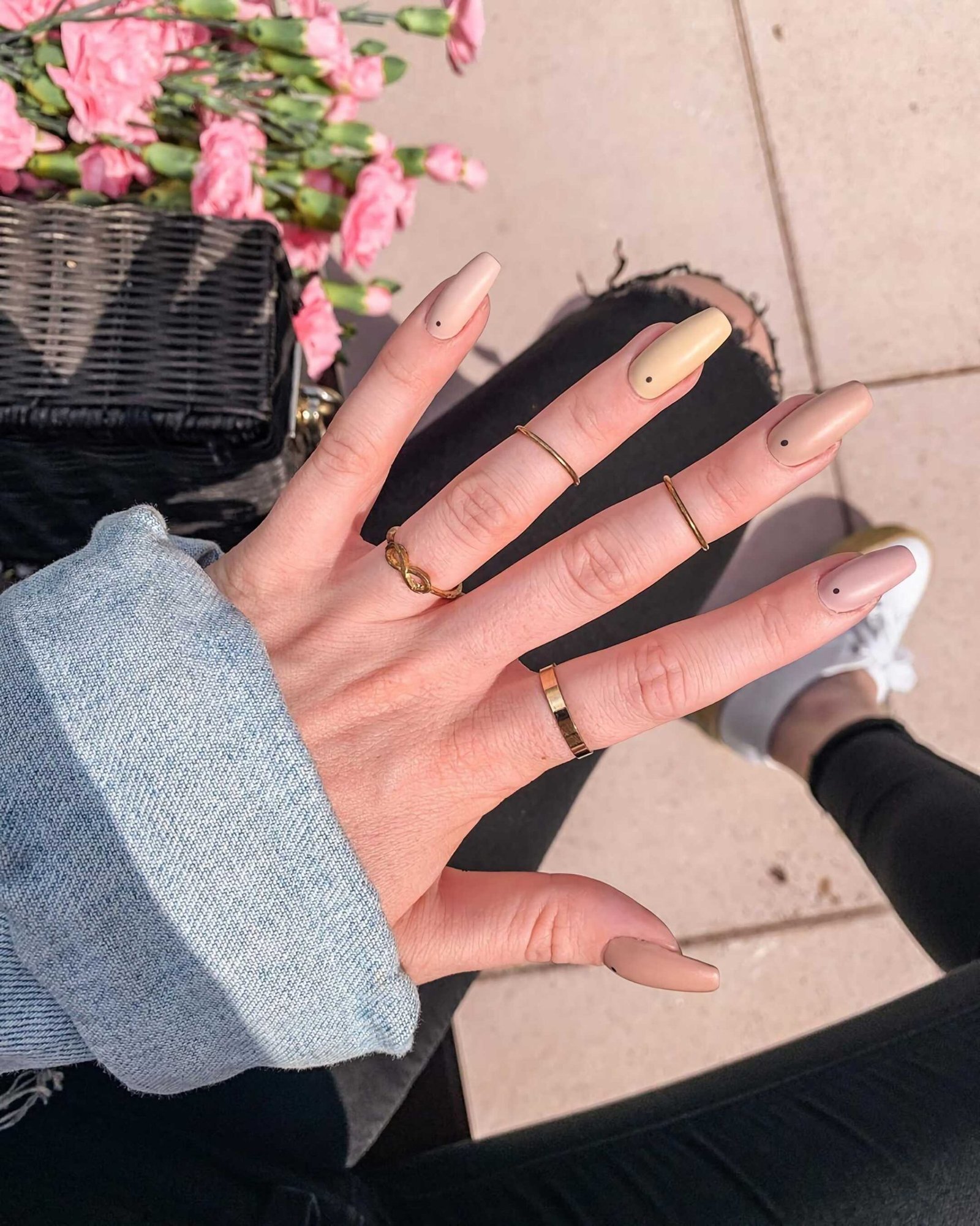 stylish beige manicure with black dots