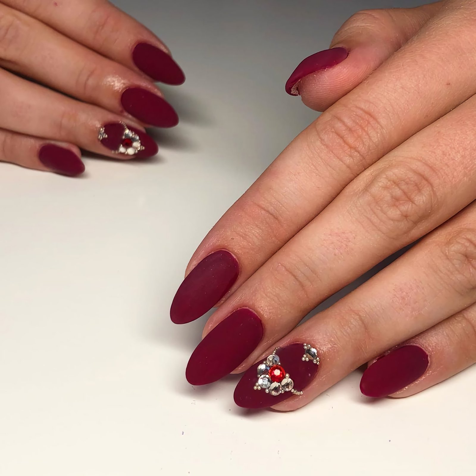 matte red nails with stones