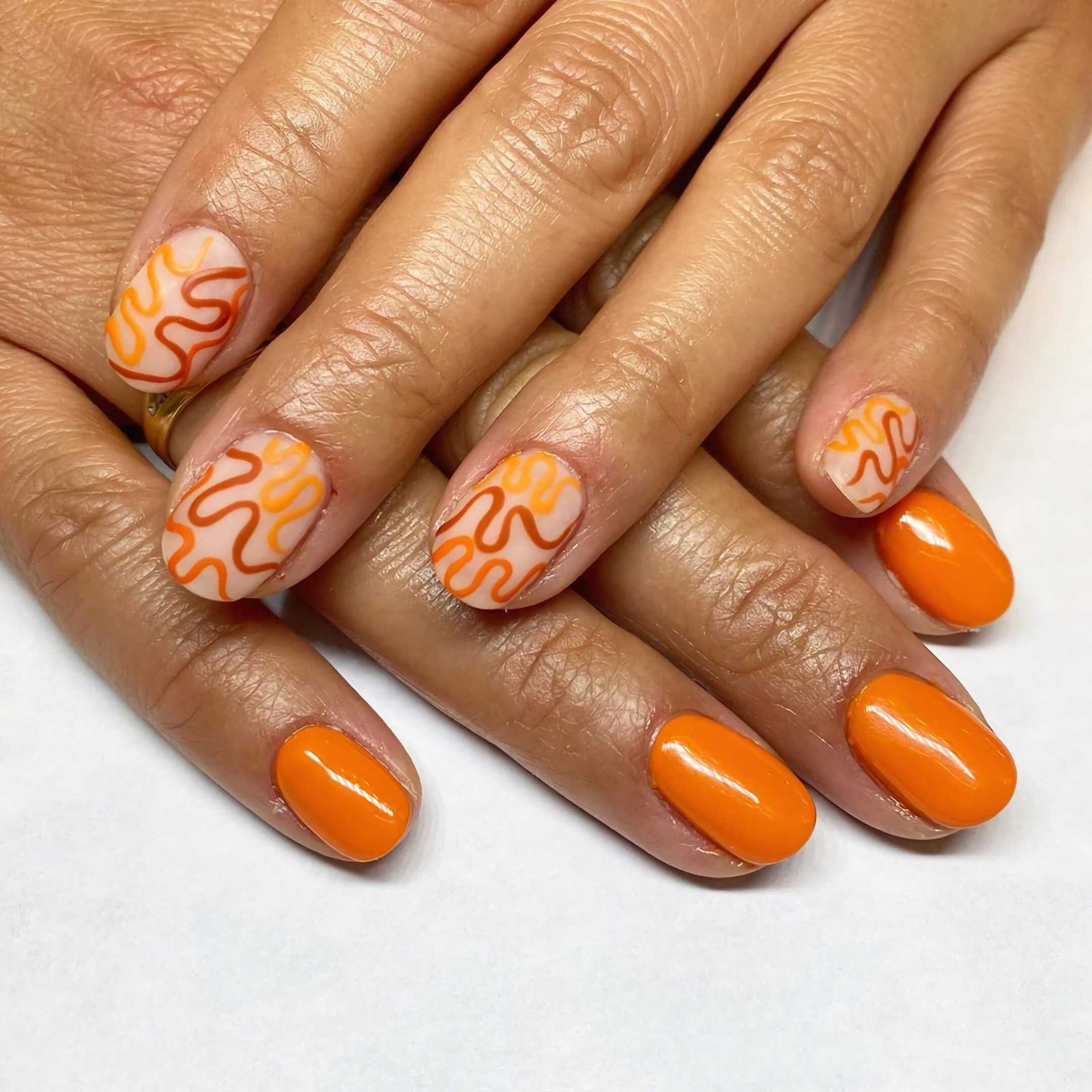 short nails with orange color