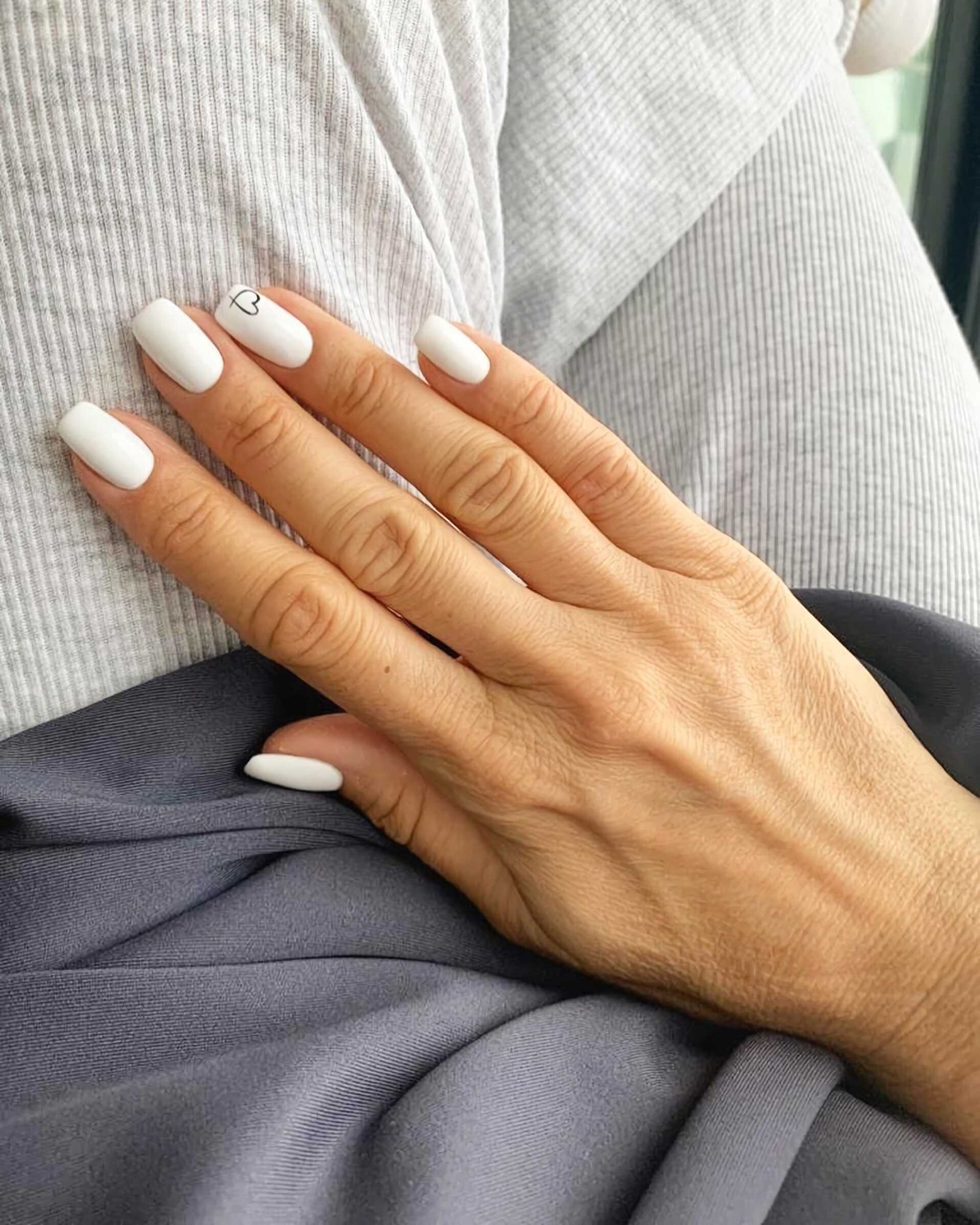 trendy short white nails with a heart