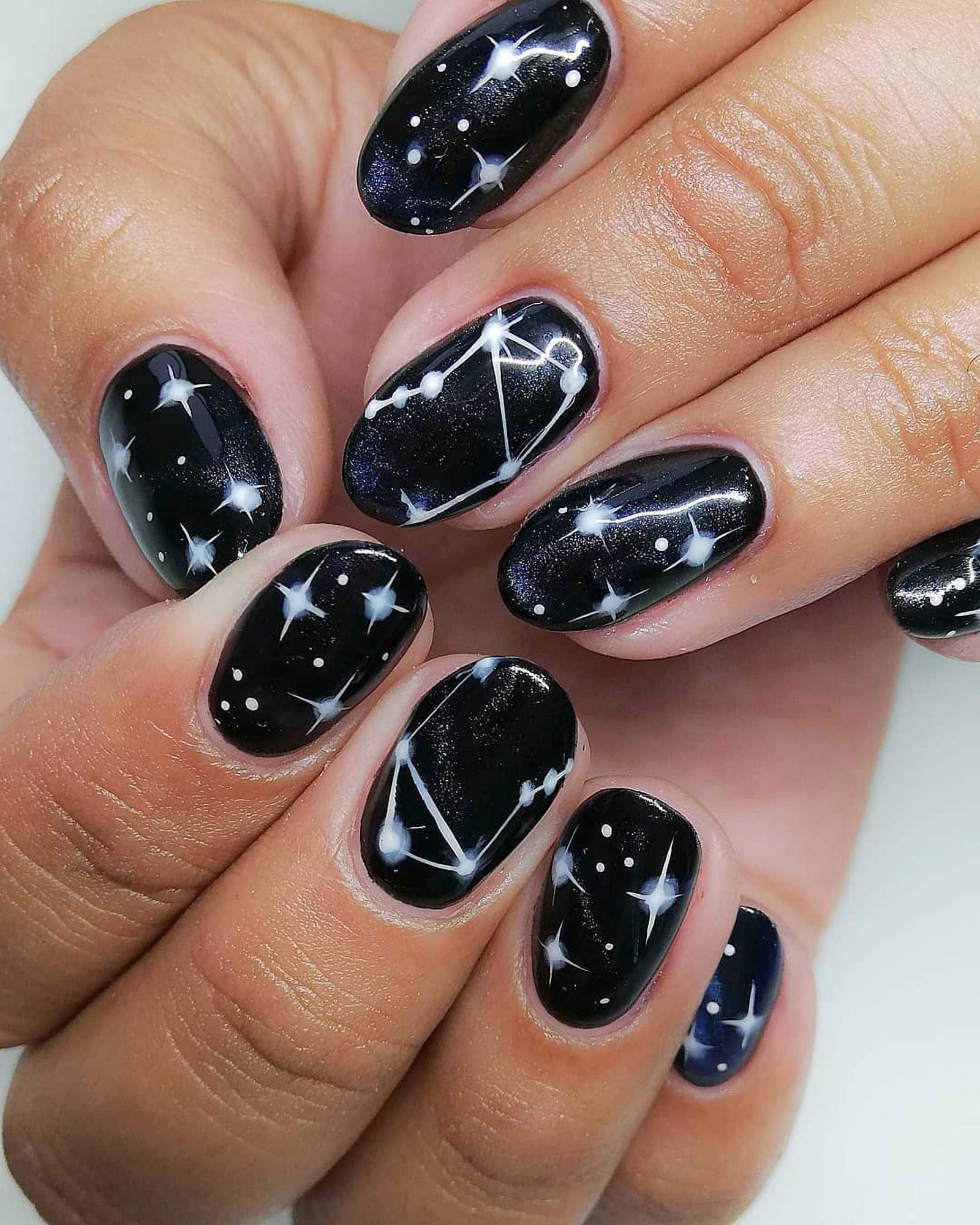 short nails with night sky pattern