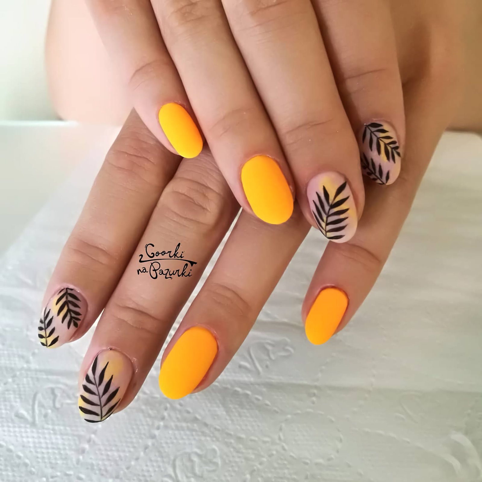 yellow manicure with leaves