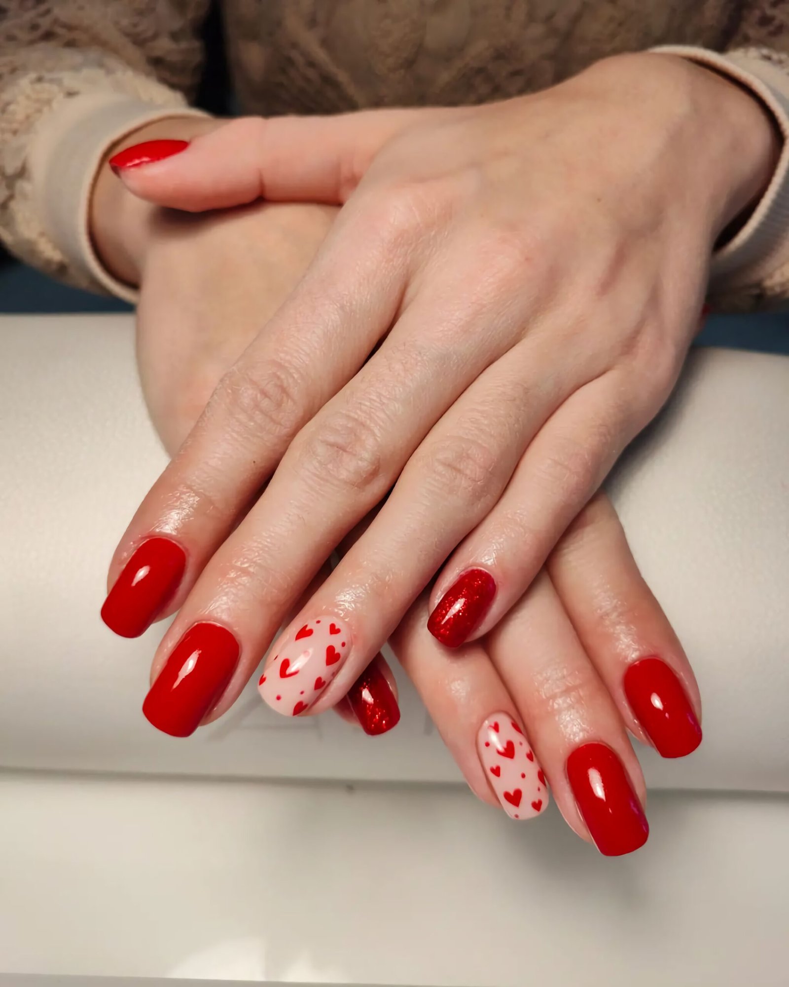 stylish and beautiful red manicure with hearts
